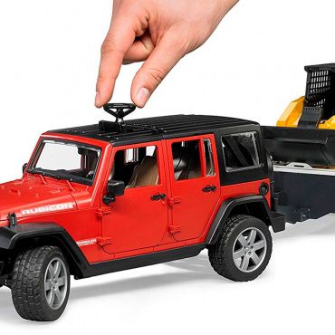 02925 Игрушка из пластмассы Bruder Внедорожник Jeep Wrangler с мини-погрузчиком Caterpillar